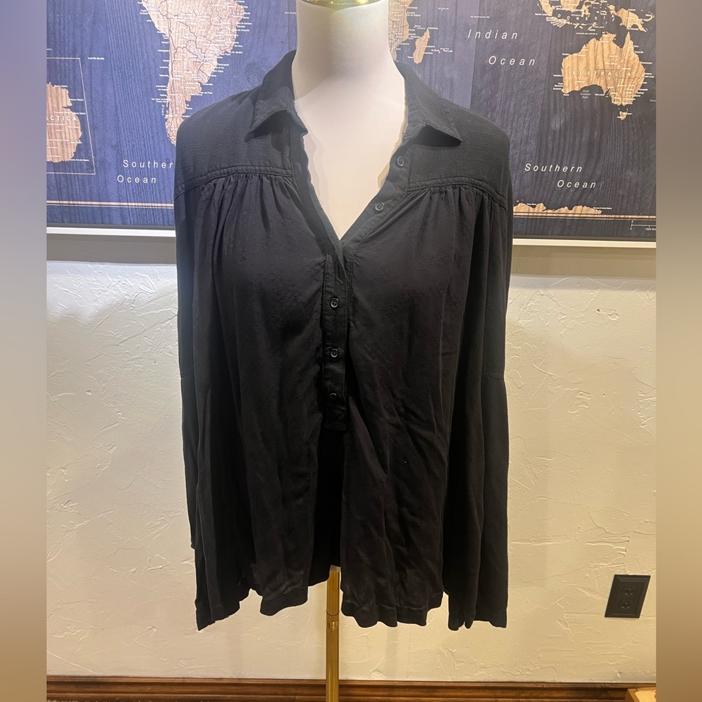 Free People oversized black top with collar and detail on back as shown in photo